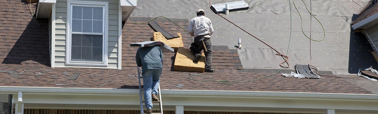Allen & Sons Roofing Services Roofers replacing a roof.