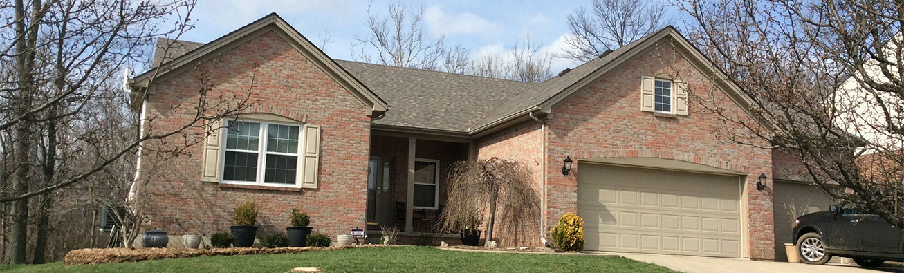 Roofers replacing a roof.